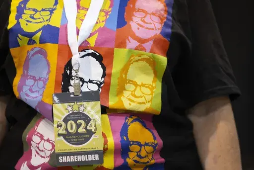 Shareholder Tina Schmidt of Cozad, Neb., wears a shirt with Warren Buffett's portrait in the style of an Andy Warhol painting at the Berkshire Hathaway annual meeting on May 4, 2024, in Omaha, Neb. (AP Photo/Rebecca S. Gratz, File)