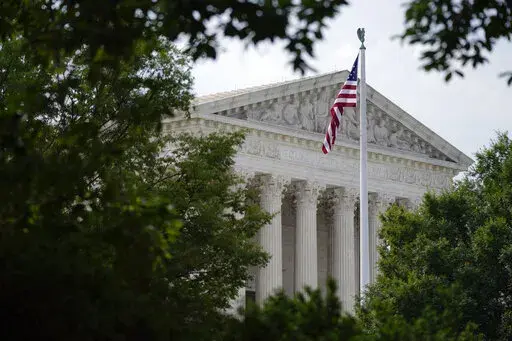 An American flag waves in front of the U.S. Supreme Court building, Monday, June 27, 2022, in Washington. (AP Photo/Patrick Semansky, File)