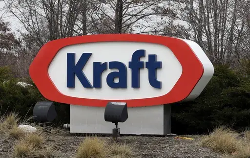 This March 25, 2015, file photo shows the Kraft logo in Northfield, Ill. The Biden administration announced $6 billion in funding Monday, March 25, 2024, for projects that will slash emissions from the industrial sector — the largest-ever U.S. investment to decarbonize domestic industry to fight climate change. Kraft Heinz will install heat pumps, electric heaters and electric boilers to decarbonize food production at numerous facilities. (AP Photo/Nam Y. Huh, File)