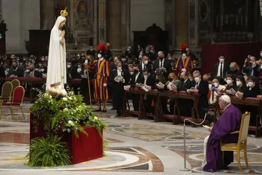 Pope Francis presides over a special prayer in St. Peter's Basilica at the Vatican, Friday, March 25, 2022. Francis is presiding over a special prayer for Ukraine that harks back to a century-old apocalyptic prophesy about peace and Russia that was sparked by purported visions of the Virgin Mary to three peasant children in Fatima, Portugal in 1917. (AP Photo/Gregorio Borgia)