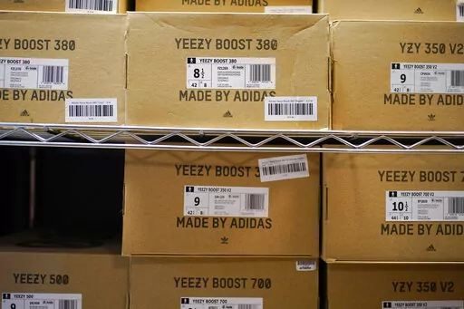 Boxes containing Yeezy shoes made by Adidas are seen at Laced Up, a sneaker resale store, in Paramus, N.J., Tuesday, Oct. 25, 2022. Adidas’ breakup with rapper Kanye West and the inability to sell his popular Yeezy line of shoes helped batter the company’s earnings at the end of last year. The German shoe and sportswear maker said Wednesday, March 8, 2023, that higher supply costs and slumping revenue in China also helped lead to a net loss of 513 million euros or $540 million in the fourth 