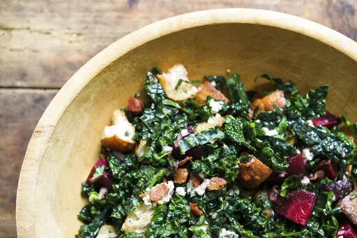 This image released by Milk Street shows a recipe for Bread Salad w/Kale, Beets & Blue Cheese. (Milk Street via AP)