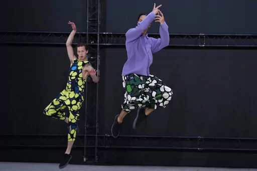 Models wear creations as part of Issey Miyake Homme Plisse men's Spring Summer 2023 collection presented in Paris, France, Thursday, June 23, 2022. (AP Photo/Francois Mori)