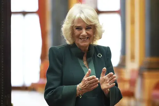 Queen Camilla applauds during a reception for winners of the Queen's Commonwealth Essay Competition, at Buckingham Palace in London, England, Thursday Nov. 21, 2024. (Aaron Chown/PA via AP, Pool, File)