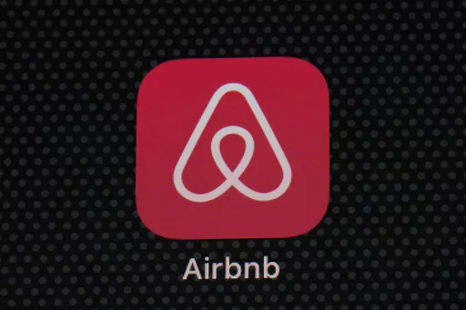 The Airbnb app icon is displayed on an iPad screen in Washington, D.C., on May 8, 2021. Airbnb says it's cracking down on fake listings, which are emerging as a major problem for customers of the short-term rental site. Airbnb said Wednesday Sept. 20 2023 it has removed 59,000 fake listings and blocked another 157,000 from joining the site this year. Fake listings and high cleaning fees are among several issues that customers are raising with Airbnb. (AP Photo/Patrick Semansky, File)