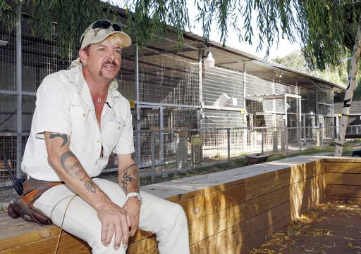 In this Aug. 28, 2013, file photo, Joseph Maldonado answers a question during an interview at the zoo he runs in Wynnewood, Okla. Maldonado known also as “Tiger King” Joe Exotic is headed to a federal courtroom Friday, Jan. 28, 2022, for a resentencing hearing. He's now in federal prison after a jury convicted him in a murder-for-hire plot involving his chief rival, Carole Baskin. (AP Photo/Sue Ogrocki, File)