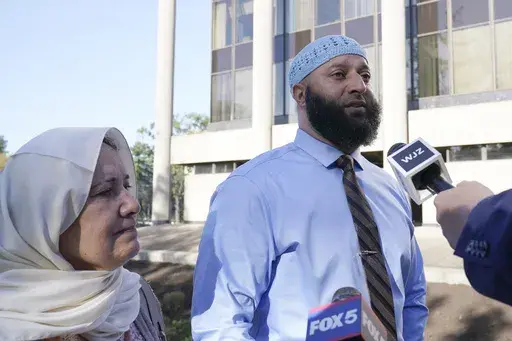 Adnan Syed and his mother Shamim Rahman talk with reporters as they arrive at Maryland's Supreme Court in Annapolis, Md., Thursday, Oct. 5, 2023, to hear arguments in an appeal by Syed, whose conviction for killing his ex-girlfriend more than 20 years ago was chronicled in the hit podcast "Serial." (AP Photo/Susan Walsh, File)