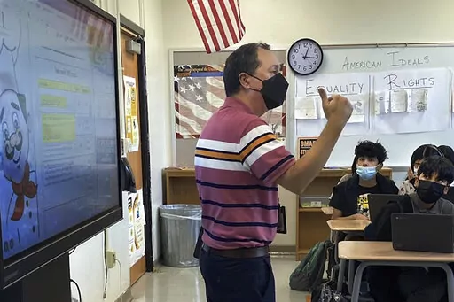This photo shows Daniel Santos, a middle school history teacher during class, in Houston, in November, 2021. Teachers around the U.S. are confronting classrooms where as many as half of students are absent. That's because they have been exposed to COVID-19 or their families kept them at home out of concern about the surging coronavirus. F  (Courtesy Daniel Santos via AP)