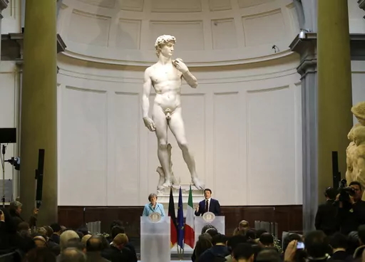German Chancellor Angela Merkel, left, and Italian Prime Minister Matteo Renzi speak during a press conference in front of Michelangelo's "David statue" after their bilateral summit in Florence, Italy, Jan. 23, 2015. A Florida charter school principal has been forced to resign after a parent complained sixth graders were exposed to pornography during a lesson on Renaissance art that included Michelangelo’s “David” sculpture. (AP Photo/Antonio Calanni, File)