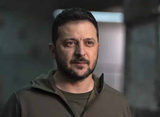 Ukrainian President Volodymyr Zelenskyy poses for a photo after his interview with The Associated Press in Kharkiv, Ukraine, Nov. 30, 2023. Zelenskyy will address U.S. military officers at the National Defense University as part of a last-minute push to convince Congress to provide more money for weapons before funding runs out. President Joe Biden has asked Congress for $61.4 billion for wartime funding for Ukraine as part of a $110 billion package that also includes money for Israel and other 