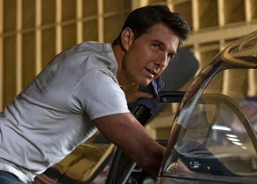 This image released by Paramount Pictures shows Tom Cruise portraying Capt. Pete "Maverick" Mitchell in a scene from "Top Gun: Maverick."  The widow and son of the man who wrote the 1983 article that inspired the original “Top Gun” are suing Paramount Pictures over its sequel, “Top Gun: Maverick.” (Scott Garfield/Paramount Pictures via AP)