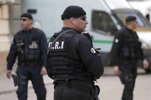 Officers of the Algerian Rapid Intervention Force (BRI) patrol outside the palace of justice on Dec. 2, 2019. A team from Algeria's Rapid Intervention Force on March 24, 2022 put Mohamed Benhalima, 32, in their vehicle, strapping him with a protective vest before the ride to his still unknown destination, video on social media shows. hree days later, Algerians could watch the televised confession of Benhalima, who went from faithful servant of his homeland as a non-commissioned officer to suppor