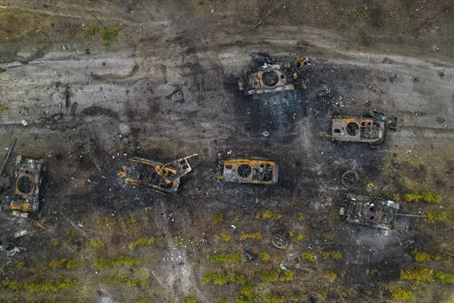 Destroyed Russian armored vehicles sit on the outskirts of Kyiv, Ukraine, Thursday, March 31, 2022. (AP Photo/Rodrigo Abd)