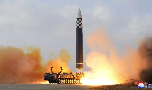 This photo provided by the North Korean government shows the test-firing of what it says a Hwasong-17 intercontinental ballistic missile at Pyongyang International Airport in Pyongyang, North Korea, on Nov. 18, 2022. In a major break from its strictly self-defense-only postwar principle, Japan adopted a national security strategy Friday, Dec. 16, 2022, declaring plans to possess preemptive strike capability and cruise missiles within years to give itself more offensive footing against threats fr