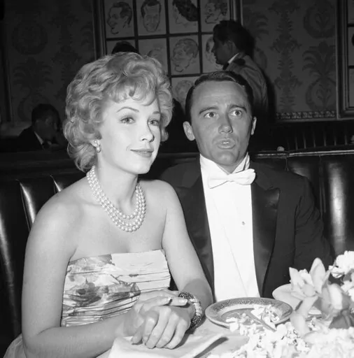 Actress Stella Stevens and actor Robert Vaughn, a nominee for best supporting actor of the year for "The Young Philadelphians," arrive at the Academy Award fashion show which preceded the Oscar presentations in Hollywood, April 4, 1960. Stevens, a prominent leading lady in 1960s and '70s comedies who is perhaps best known for playing the object of Jerry Lewis’s affection in “The Nutty Professor,” died Friday. She was 84. (AP Photo, File)