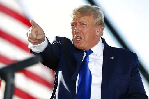 Former President Donald Trump speaks at a rally at the Delaware County Fairgrounds, April 23, 2022, in Delaware, Ohio. Former President Donald Trump has paid the $110,000 in fines on Thursday, May 19, 2022, that he racked up after being held in contempt of court for being slow to respond to a civil subpoena issued by New York's attorney general Letitia James. (AP Photo/Joe Maiorana, File)