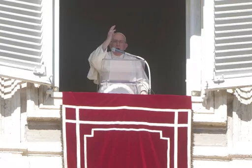 Pope Francis blesses the faithful from his studio's window overlooking St. Peter's Square on the occasion of the Angelus noon prayer at the Vatican, Sunday, Oct. 16, 2022.(AP Photo/Gregorio Borgia)