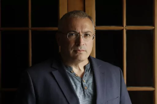 Russian opposition figure Mikhail Khodorkovsky, the former owner of the Yukos Oil Co., poses for a photo after being interviewed by The Associated Press in London, Tuesday, July 24, 2018. After President Vladimir Putin came to power in 2000, he was reported to have told about two dozen of the men regarded as Russia's top oligarchs that if they stayed out of politics, their wealth wouldn't be touched. Khodorkovsky, regarded as Russia's richest man at the time, established the Open Society reformi