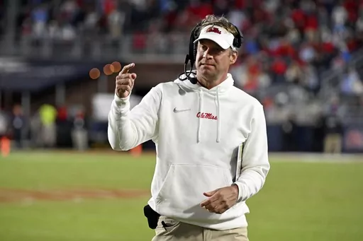 FILE -Mississippi head coach Lane Kiffin gestures during the second half of an NCAA college football game against Arkansas in Oxford, Miss., Saturday, Oct. 7, 2023. A lawsuit accusing Mississippi football coach Lane Kiffin of racial and sexual discrimination and negligence was dismissed Wednesday, Jan. 31, 2024. (AP Photo/Thomas Graning, File)