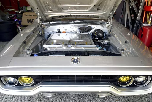 Kevin Erickson's electrified 1972 Plymouth Satellite is seen at his Commerce City, Colo., home on Sept. 20, 2022. Erickson is part of a small but expanding group of tinkerers, racers, engineers, and entrepreneurs across the country converting vintage cars and trucks into greener, often much faster, electric vehicles. (AP Photo/Thomas Peipert)