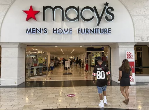 Shoppers walk into a Macy's department store Monday, Feb. 22, 2021, at Miami International Mall in Doral, Fla. Macy's reports earnings on Thursday, Nov. 16, 2023. (AP Photo/Wilfredo Lee, File)