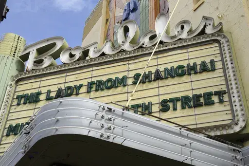 Movies are advertised on the Boulder Theater marquee in Boulder, Colo., Friday, March 28, 2025. (AP Photo/Thomas Peipert)