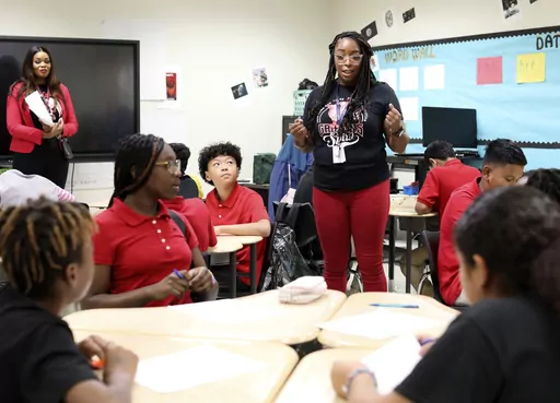 Jennifer Williams, center, teaches math at Tasby Middle School in Dallas, Texas, on Sep 15, 2023. (Jason Janik/The Dallas Morning News via AP)