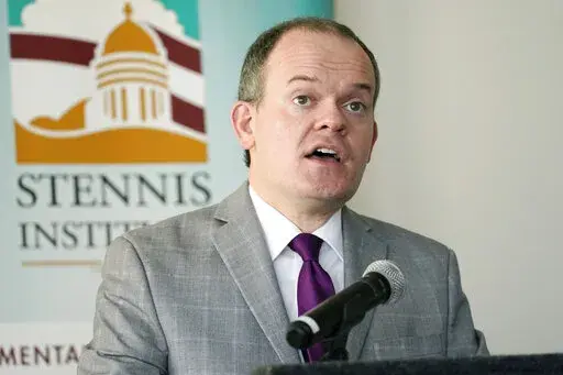 State Economist J. Cory Miller says employment in Mississippi decreased during the first months of the coronavirus pandemic in 2020, but personal income in the state increased during that time because of federal payments that were intended to head off a steep decline in the national economy, at the Stennis Capitol Press Forum in Jackson, Miss., Monday, Feb. 28, 2022. (AP Photo/Rogelio V. Solis)