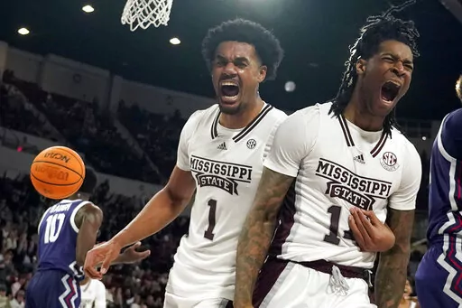 Mississippi State forward Tyler Stevenson, right, and forward Tolu Smith (1) celebrate after scoring and drawing a foul from a TCU player during the second half of an NCAA college basketball game in Starkville, Miss., Saturday, Jan. 28, 2023. (AP Photo/Rogelio V. Solis)