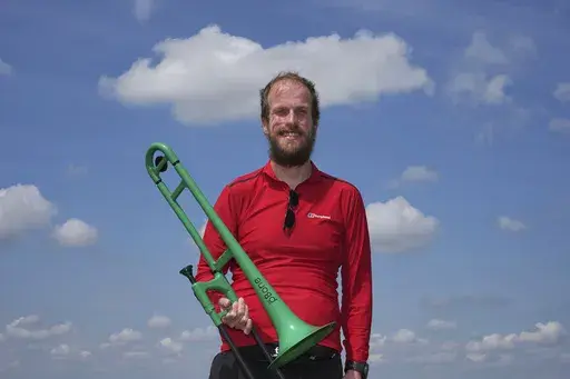 Nathaniel Dye poses for a photograph during an interview in London, Tuesday, June 18, 2024. Dye, who was diagnosed with bowel cancer and faced delays in treatment, is hoping the opposition Labour Party will win the July 4 election and fix problems with Britain’s National Health Service. (AP Photo/Kin Cheung)