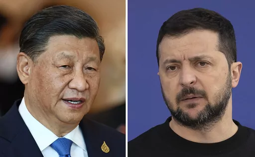 This combination of file photos shows China's President Xi Jinping, taken in Bangkok, Thailand, on Nov. 19, 2022, and Ukrainian President Volodymyr Zelenskyy taken outside Kyiv, Ukraine, on April 7, 2023. Chinese leader Xi talked Wednesday, April 26, 2023, with Ukrainian President Zelenskyy by phone and appealed for negotiations in Russia's war against his country, warning "there is no winner in a nuclear war," state media said, in a long-anticipated conversation after Beijing said it wanted to 
