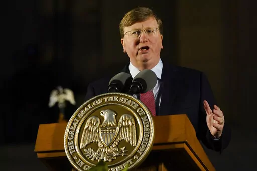 Republican Gov. Tate Reeves describes the state's economic progress during his State of the State address before a joint session of the Mississippi Legislature on the steps of the State Capitol in Jackson, Miss., on Jan. 30, 2023. Reeves did an abrupt about-face Sunday, Feb. 26, 2023, on an issue for which Democrats have been criticizing him this election year, saying for the first time that he wants the state to allow a full year of Medicaid coverage to women after they give birth. (AP Photo/Ro