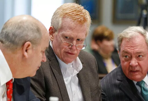 Defendant Alex Murdaugh, seated between his two layers Jim Griffin and Dick Harpootlian, listens during his double murder trial at the Colleton County Courthouse in Walterboro, S.C., Friday, Jan. 27, 2023. (Grace Beahm Alford/The Post And Courier via AP, Pool)