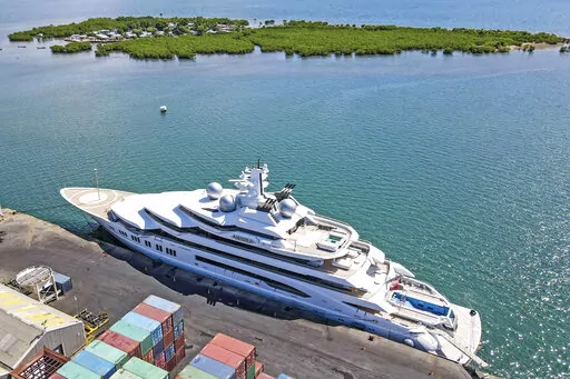 The superyacht Amadea is docked at the Queens Wharf in Lautoka, Fiji, on April 15 2022. A judge in Fiji has ruled that U.S. authorities can seize the Russian-owned superyacht — but has put a hold on his order until at least Friday, May 6, while defense lawyers mount a challenge. (Leon Lord/Fiji Sun via AP, File)