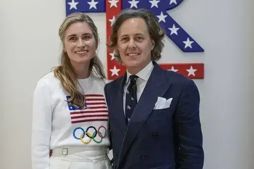 Lauren Bush Lauren, left, and David Lauren pose for photographers upon arrival at a Ralph Lauren event during the 2024 Summer Olympics, Saturday, July 27, 2024, in Paris, France. (AP Photo/Natacha Pisarenko)