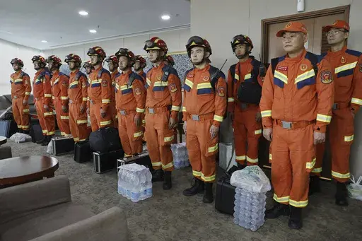In this photo released by Xinhua News Agency, Chinese rescuers arrive at the Yangon International Airport in Yangon, Myanmar on Saturday, March 29, 2025. (Haymhan Aung/Xinhua via AP)
