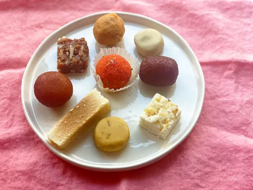 An assortment of sweets from an Indian food shop are displayed in New York on Oct. 19, 2022. These sweets are typically enjoyed on Diwali, the Hindu festival of lights. (Katie Workman via AP)