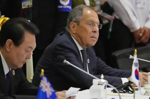 Sitting next to South Korea President Yoon Suk Yeol, left, Russian Foreign Minister Sergey Lavrov listens during the ASEAN Australia-New Zealand Trade Area (AANZTA) in Phnom Penh, Cambodia, Sunday, Nov. 13, 2022.  Lavrov has been taken to the hospital after suffering a health problem following his arrival for the Group of 20 summit in Bali, Indonesian authorities said Monday. (AP Photo/Heng Sinith, File)