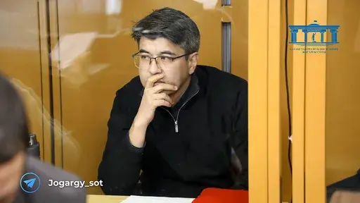 In this photo released by the Kazakhstan Supreme Court Press Office’s Telegram channel on Friday, April 12, 2024, businessman Kuandyk Bishimbayev, the country’s former economy minister, sits in a defendants’ cage at his trial in Astana, Kazakhstan. Bishimbayev is on trial for killing his wife, Saltanat Nukenova, and the case has touched a nerve in the Central Asian country, with tens of thousands of people signing petitions calling for harsher penalties for domestic violence. On April 11, 