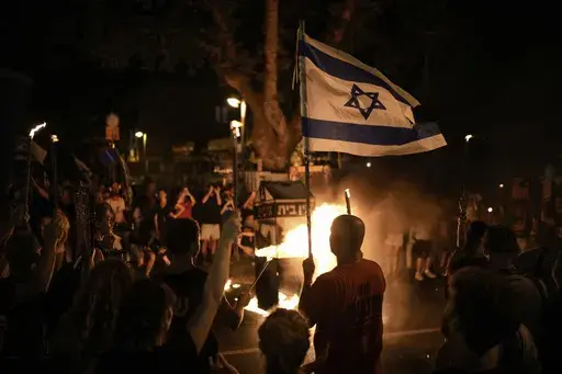 People protest against Israeli Prime Minister Benjamin Netanyahu's government and call for the release of hostages held in the Gaza Strip by the Hamas militant group, in Tel Aviv, Israel, Saturday, June 22, 2024. (AP Photo/Leo Correa)