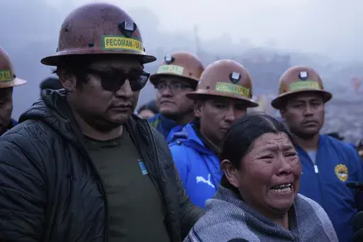 Delia Acarapi, who says her daughter died in an explosive attack, cries near the Hijos de Ingenio gold mine in Yani, Bolivia, Thursday, April 3, 2025. (AP Photo/Juan Karita)