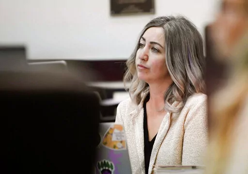 RaDonda Vaught, a former Vanderbilt University Medical Center nurse charged with in the death of a patient, listens to the opening statements during her trial at Justice A.A. Birch Building in Nashville, Tenn., Tuesday, March 22, 2022. Vaught was charged with reckless homicide for accidentally administering the paralyzing drug vecuronium to 75-year-old Charlene Murphey instead of the sedative Versed in December on Dec. 26, 2017. Vaught admitted the error as soon as she realized it, and the state