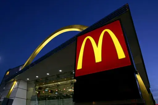 The McDonald's restaurant logo and golden arch is lit up, April 20, 2006, in Chicago. McDonald’s plans to introduce a $5 meal deal in the U.S. in June 2024 to counter slowing sales and customers’ frustration with high prices. (AP Photo/Jeff Roberson, File)