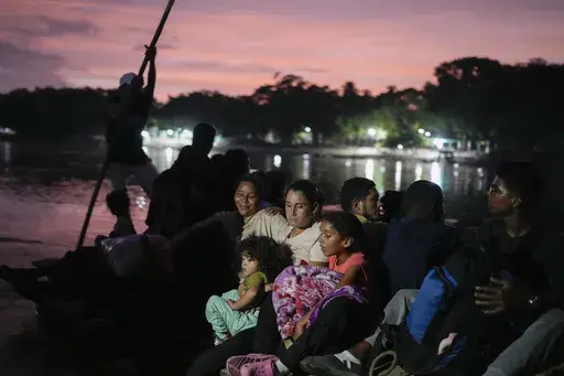 Severe shortages and one of the world’s highest inflation rates have helped drive nearly 8 million Venezuelans from the petrostate of 28 million people, including Venezuelan migrant Lisbeth Contreras, who hugs her children as she crosses the Suchiate River on the border between Guatemala and Mexico, on Oct. 26, 2024. (AP Photo/Matias Delacroix, File)