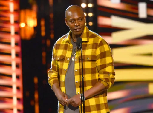 Dave Chappelle appears during the Rock & Roll Hall of Fame induction ceremony on Oct. 30, 2021, in Cleveland. Chappelle was tackled during a performance at the Hollywood Bowl Tuesday, May 3, 2022. Security guards chased and overpowered the attacker, and Chappelle was able to continue his performance while the man was taken away in an ambulance. (AP Photo/David Richard, File)
