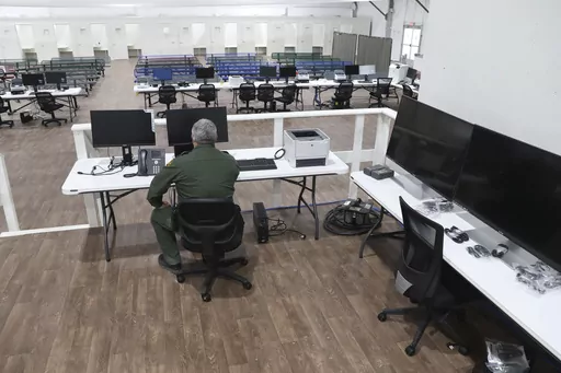 In this photo provided by the U.S. Customs and Border Protection is an interior view of the soft-sided migrant processing facility in Laredo, Texas, on Sept. 23, 2021. As the Biden administration prepared to launch speedy asylum screenings at the border in April, authorities pledged a key difference from a Trump-era version of the policy: Migrants would be guaranteed access to legal representation. Nearly three months and thousands of screenings later, the promise of attorney access appears unfu