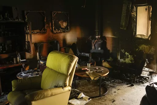 Destroyed furniture and charred walls are seen in a home that came under attack during a massive Hamas invasion into Kibbutz Nir Oz, Israel, Thursday, Oct. 19, 2023. Nir Oz is one of more than 20 towns and villages in southern Israel that were ambushed in the sweeping assault by Hamas on Oct. 7. The kibbutz on a low rise overlooking the border fence with Gaza suffered a particularly harsh toll. About 100 of Nir Oz's 400 people are dead or missing. (AP Photo/Francisco Seco)