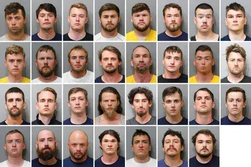 These booking images provided by the Kootenai County Sheriff’s Office show the 31 members of the white supremacist group Patriot Front who were arrested after they were found packed into the back of a U-Haul truck with riot gear near an LGBTQ pride event in Coeur d’Alene, Idaho, on Saturday, June 11, 2022. Top row, from left, are Jared Boyce, Nathan Brenner, Colton Brown, Josiah Buster, Mishael Buster, Devin Center, Dylan Corio, and Winston Durham. Second row, from left, are Garret Garland, 