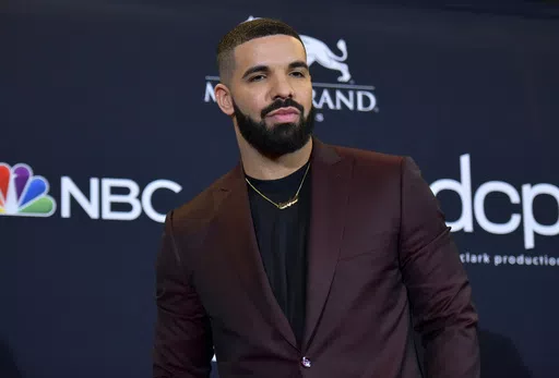 Drake poses for a photograph at the Billboard Music Awards, May 1, 2019, in Las Vegas. Hip-hop artist Drake, who had been sued for his participation in the deadly 2021 Astroworld festival in Houston in which 10 people were killed, has been dismissed from the case, a judge ruled Wednesday, April 10, 2024. (Photo by Richard Shotwell/Invision/AP, File)