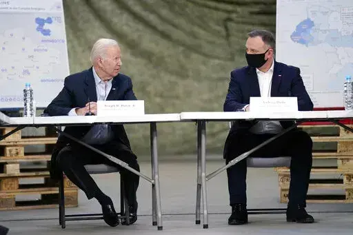 President Joe Biden and Polish President Andrzej Duda participate in a roundtable on the humanitarian response to the Russian invasion of Ukraine, Friday, March 25, 2022, in Jasionka, Poland. (AP Photo/Evan Vucci)